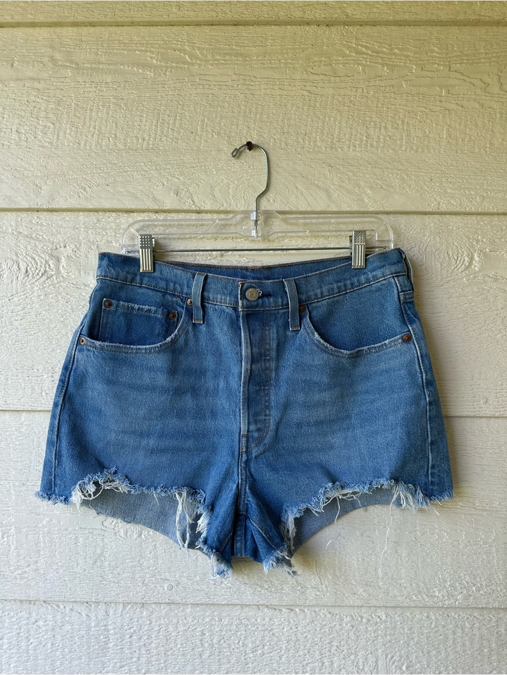 Levi’s denim shorts with a high rise fit + frayed hems